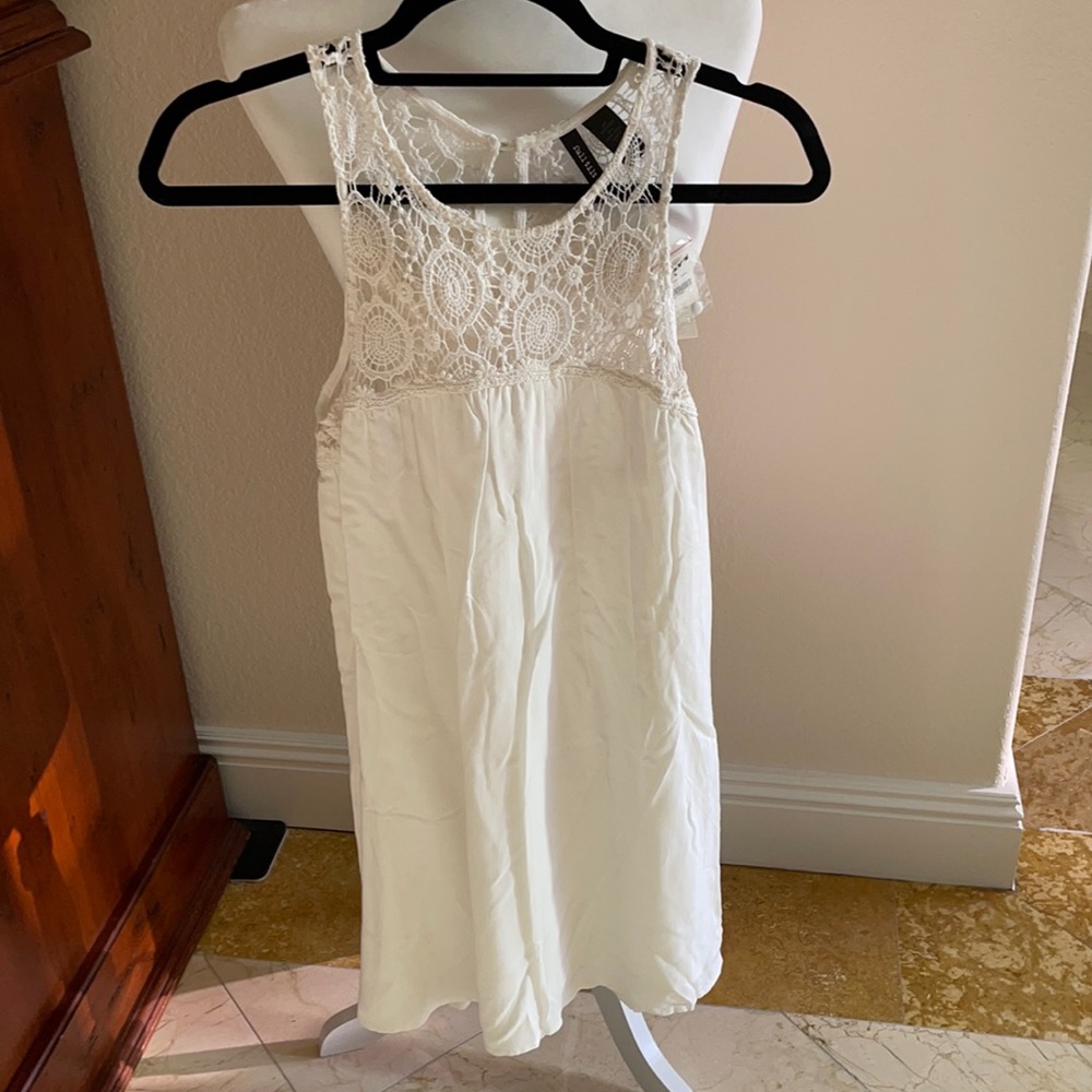 Tilly’s white cotton crochet top dress.
